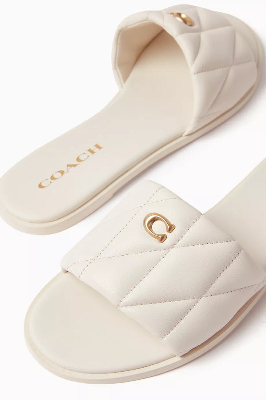 coach quilted slides